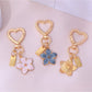Keypus floral charm keychain displayed on a white background