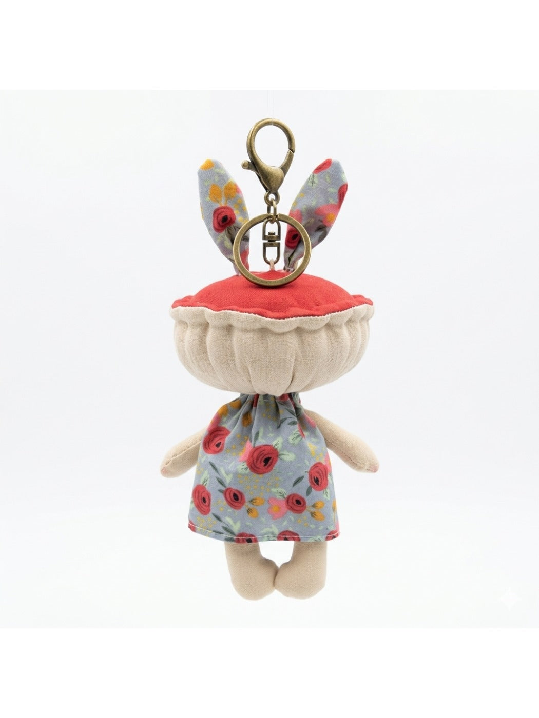 Keypus fabric doll keychain held in hand to show size and scale