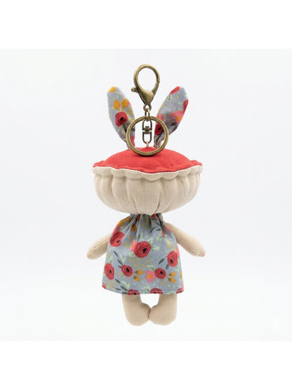 Keypus fabric doll keychain held in hand to show size and scale