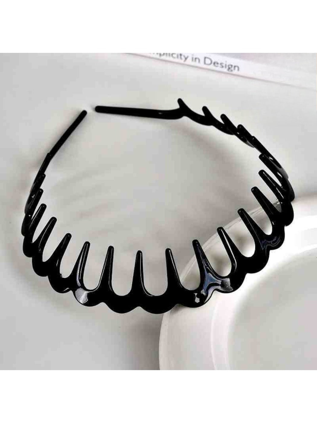 Top view of Gifty toothed wave headband displaying symmetrical wave design