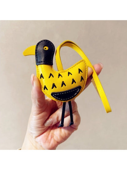 Ostrich keychain hanging from a backpack zipper pull