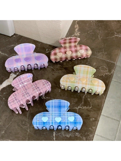 Close-up of Beau Fresh Plaid Acetate Hair Clip highlighting glossy acetate material