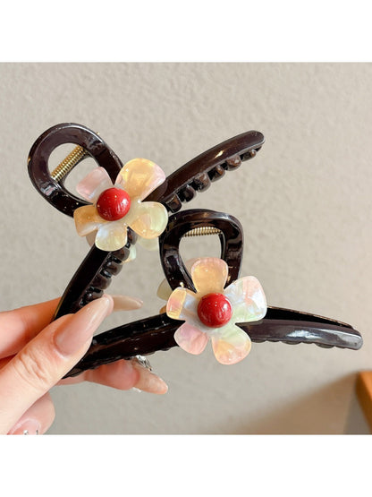 Close-up of pink flower details on the Beau claw clip