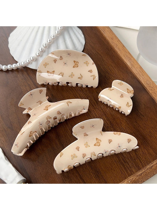 Close-up of Beau chic brown butterfly print claw clip on white background