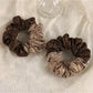 Close-up of Gifty scrunchie showing soft textured fabric and elastic band