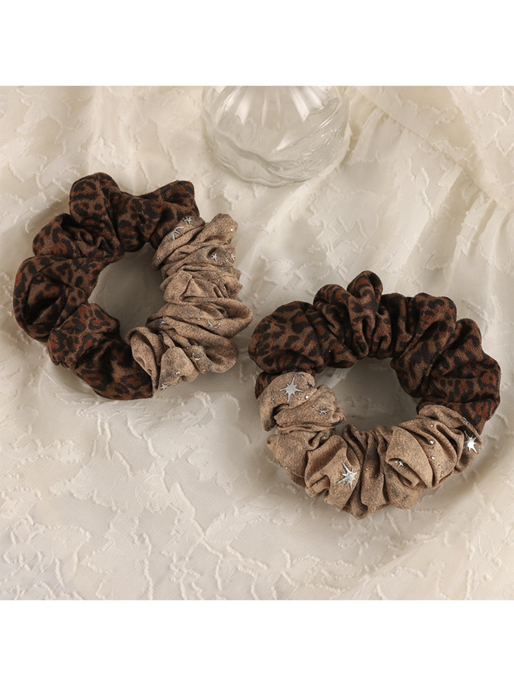 Close-up of Gifty scrunchie showing soft textured fabric and elastic band