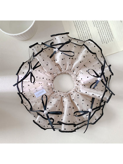 Gifty satin polka dot bow scrunchie displayed on a white background