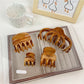 Beau hair claw clip open, displaying inner teeth and spring mechanism