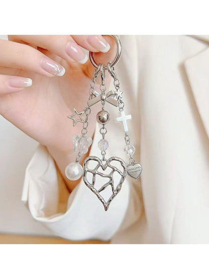 Heart shaped charm keychain with a metallic finish on a white background