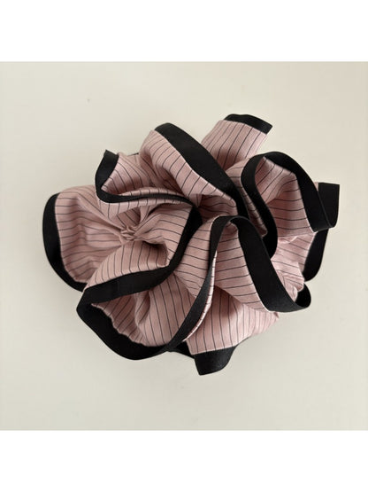 Multiple Gifty Neat Silky Zesty Scrunchies stacked to show consistent color and texture
