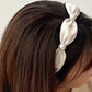 Gifty headband styled with casual outfit on model with loose hair