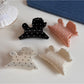 Close-up of Beau puppy hair clip showing detailed polka dot pattern and clip mechanism