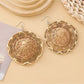Earedge earrings styled with casual summer outfit on wooden surface