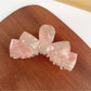 Top view of Beau classic bow shaped hair claw clip