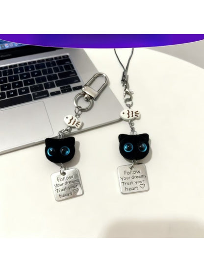 Blue eyed black cat keychain with detailed face and shiny finish
