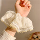 Multiple Gifty ruched scrunchies in different colors arranged neatly