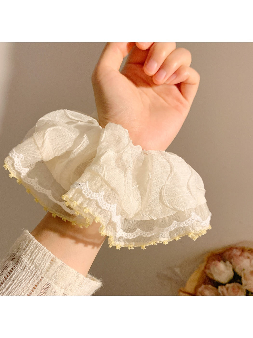 Multiple Gifty ruched scrunchies in different colors arranged neatly
