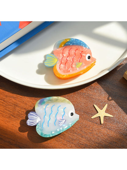 Side view of Beau tropical fish hair clip highlighting curved shape and clasp mechanism