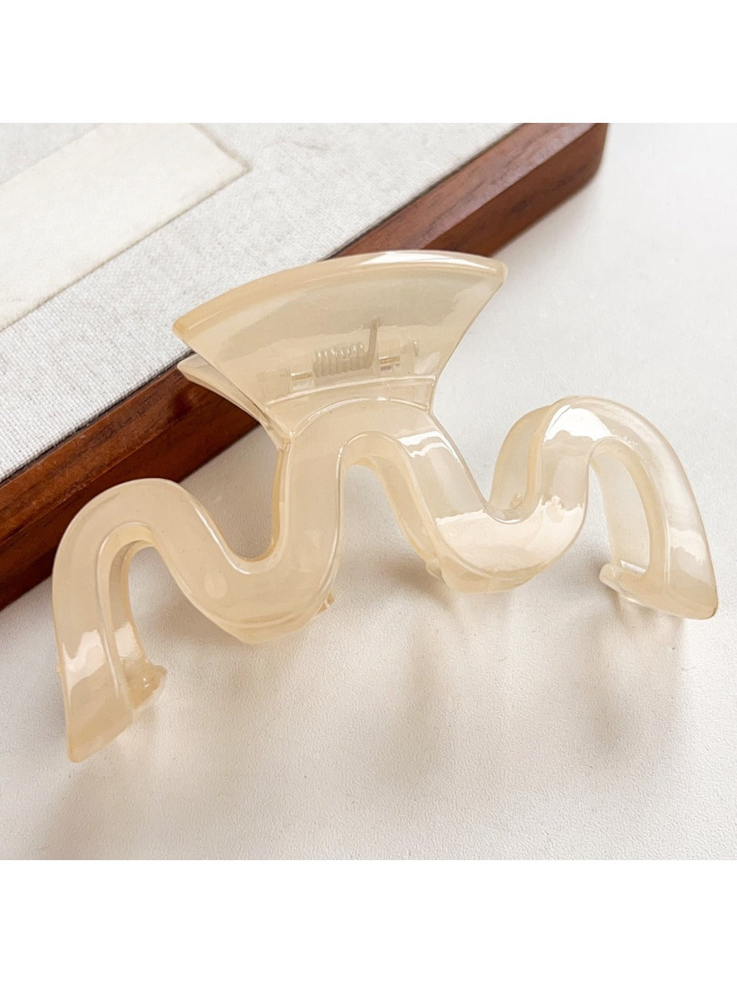 Beau hair claw clip securing half-up hairstyle on model
