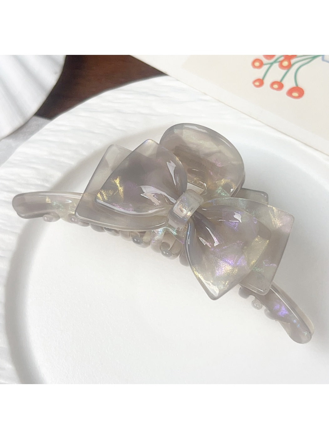 Beau double layer bow hair claw clip in light pink color on white background