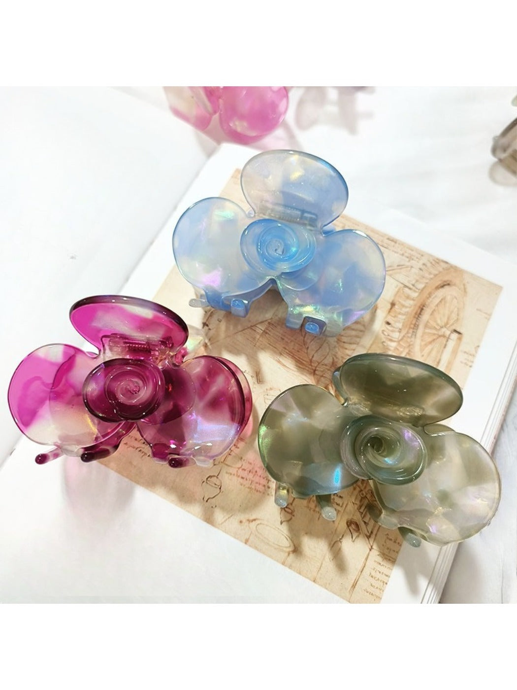 Close-up of Beau Sweet Acetate Medium Flower Claw Clip showing flower pattern and clasp