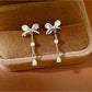 Earedge - Alloy Bow Stud Earrings with Drop Detail Earrings