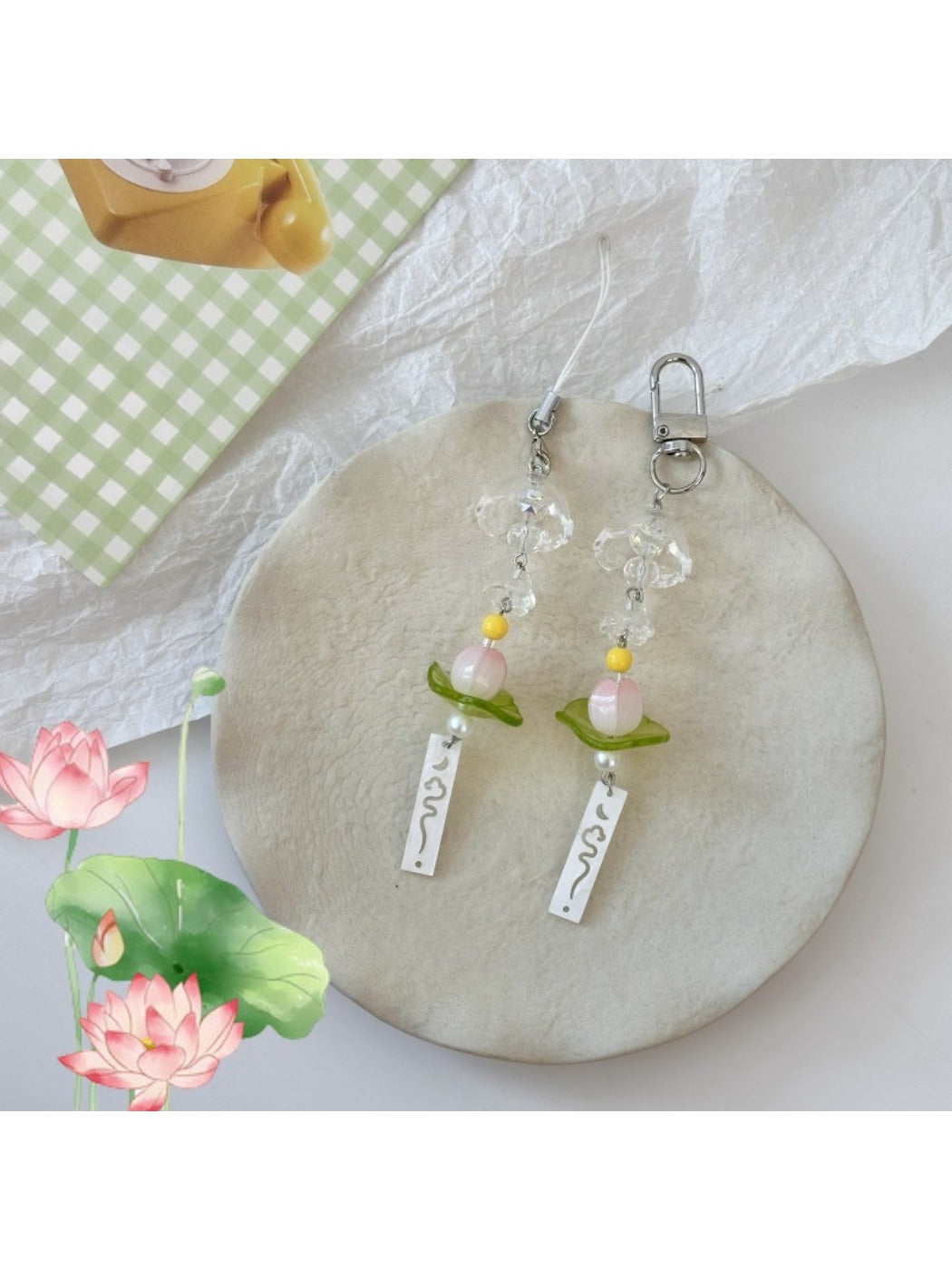 Lotus-shaped metal wind chime keychain with intricate petal design