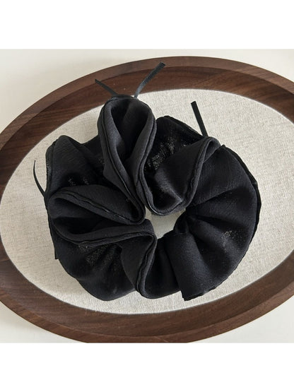 Gifty scrunchie displayed flat showing full bow and elastic band in pink chiffon
