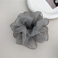 Multiple Gifty ruffled scrunchies in different colors arranged together