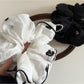Gifty small delicate mesh scrunchie stretched to show elastic band inside
