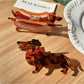 Close-up of Beau dachshund claw clip showing detailed cartoon dog face and ears
