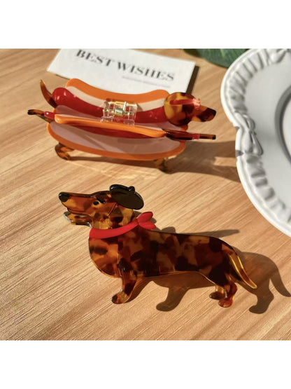 Close-up of Beau dachshund claw clip showing detailed cartoon dog face and ears