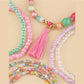 Lovra bracelet worn on wrist featuring multiple strands of bright beads in various colors