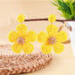 Close-up of the knitted texture on earedge flower shaped earrings