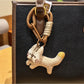 Keypus squirrel charm keychain held in hand to show size and detail