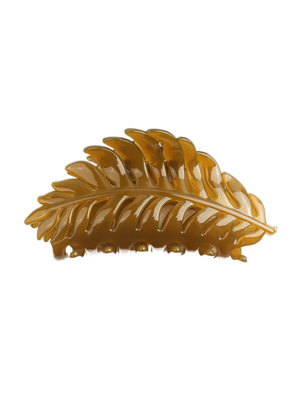 Beau hair clip on a marble countertop with soft lighting