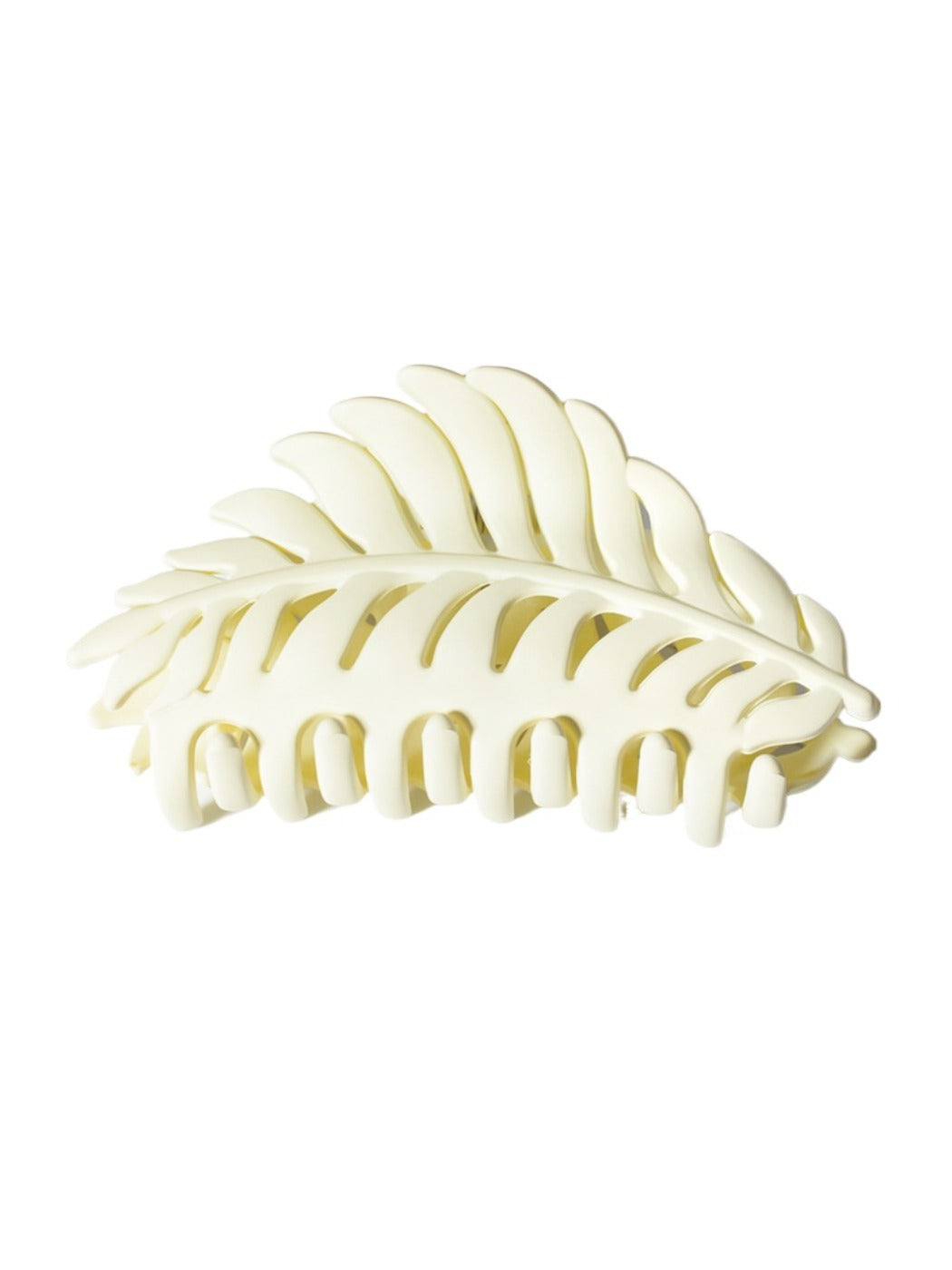 Beau leaf hair clip with light reflecting off its surface