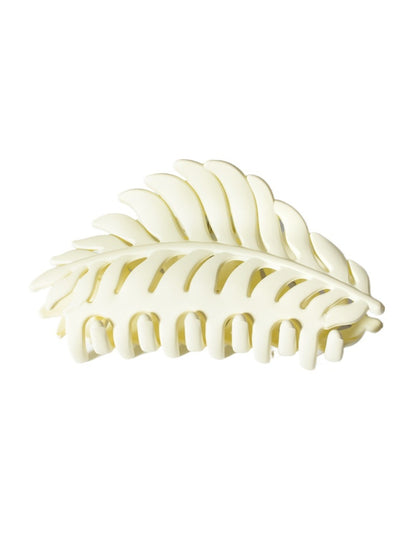 Beau leaf hair clip with light reflecting off its surface
