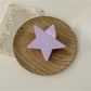 Beau star shaped claw clip displayed with hair strands to show use