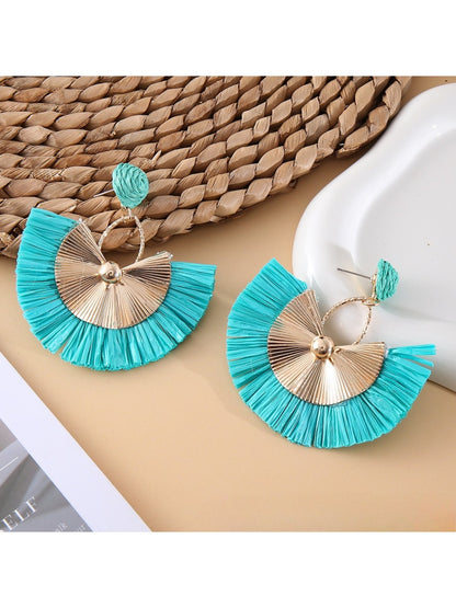 Pair of raffia fan earrings with light brown woven design and gold accents