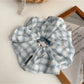 Scrunchie headband wrapped around wrist as a stylish accessory