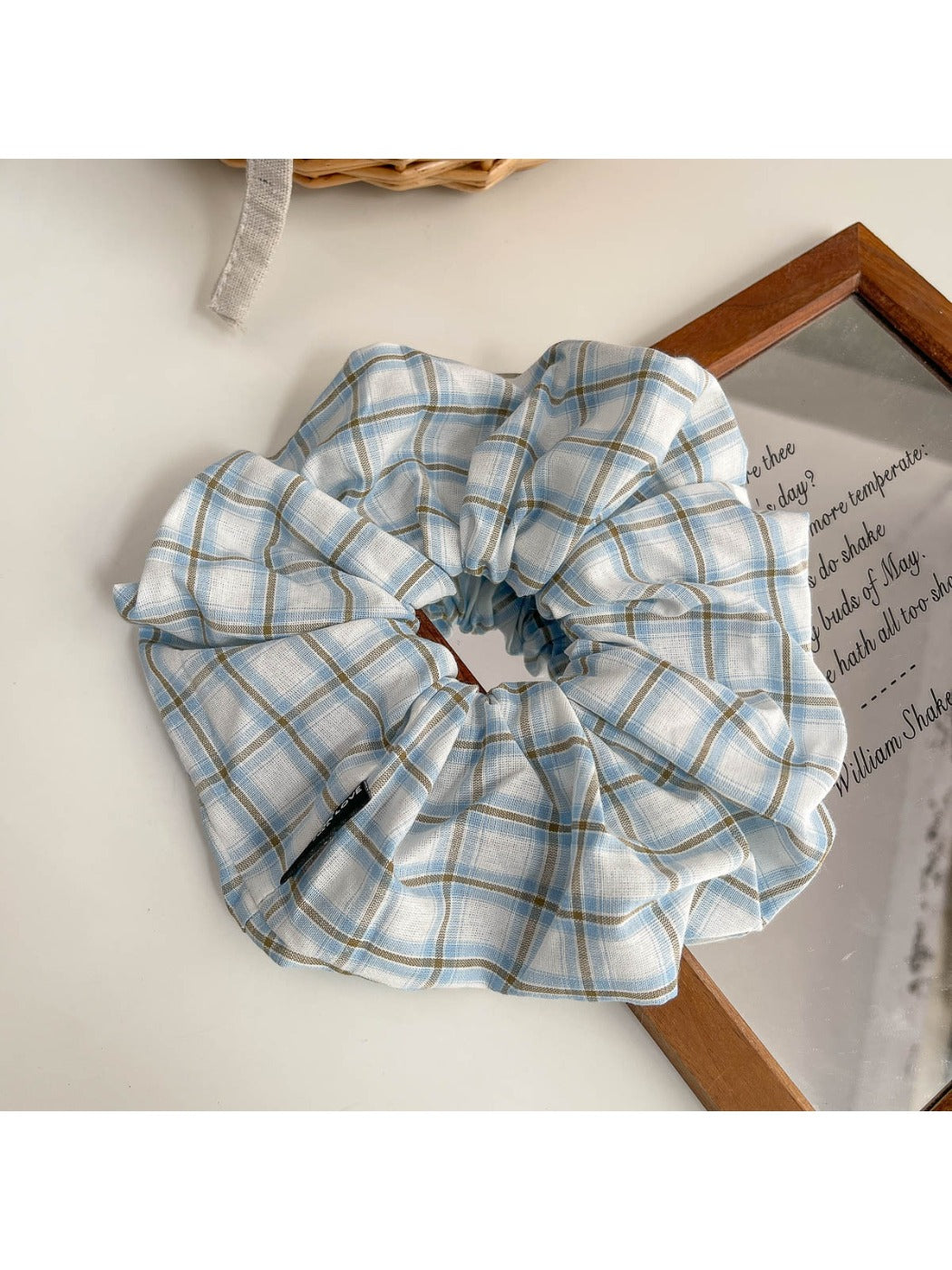 Scrunchie headband wrapped around wrist as a stylish accessory