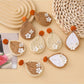 Close-up of Earedge raffia woven teardrop shaped earrings on white background