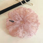 Large pink tulle scrunchie with tiny floral pattern on a white background