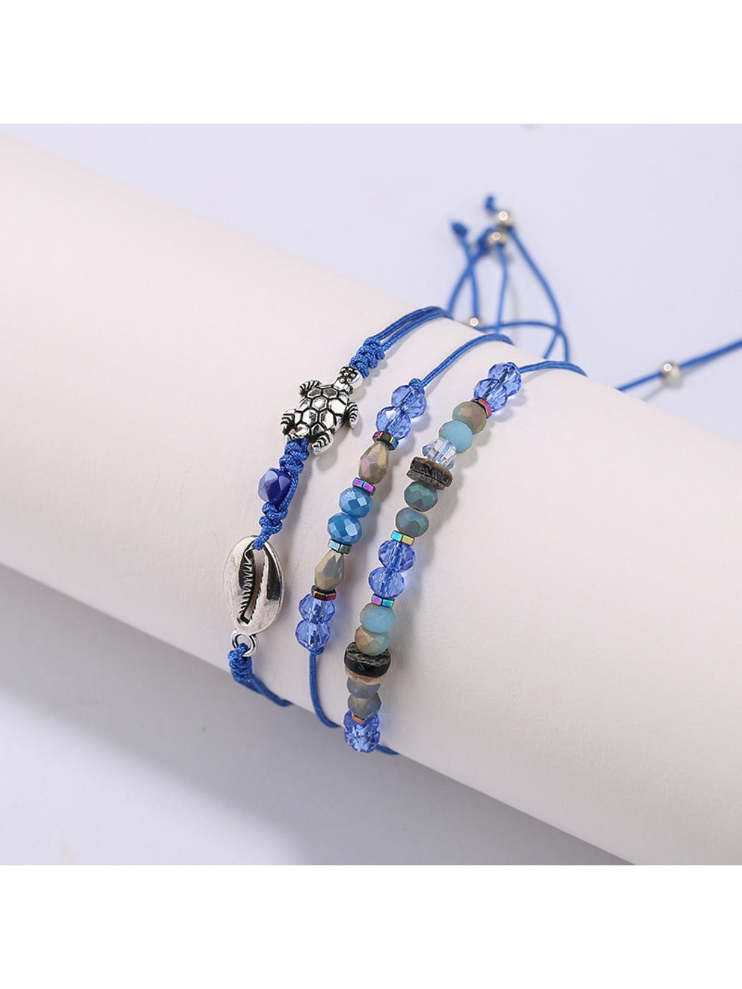 Lovra small bead bracelet laid flat showing full length and charm placement