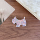 Beau acetate puppy hair clip displayed on a white background for clear detail