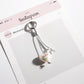 Multiple Keypus keychains in white style arranged in a row
