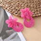 Sweet Raffia Flower Shaped Stud Earrings worn on a model's ear