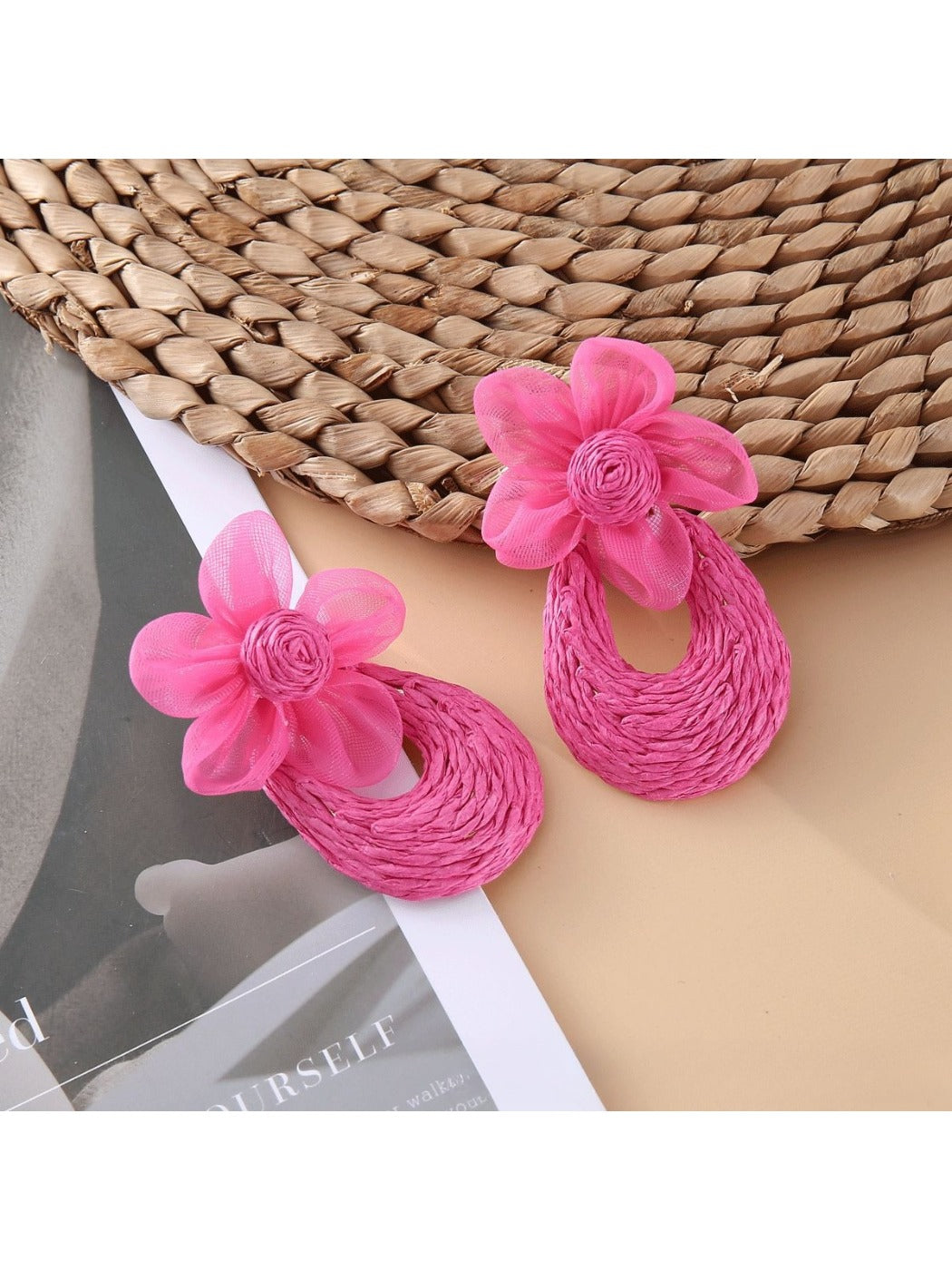 Sweet Raffia Flower Shaped Stud Earrings worn on a model's ear