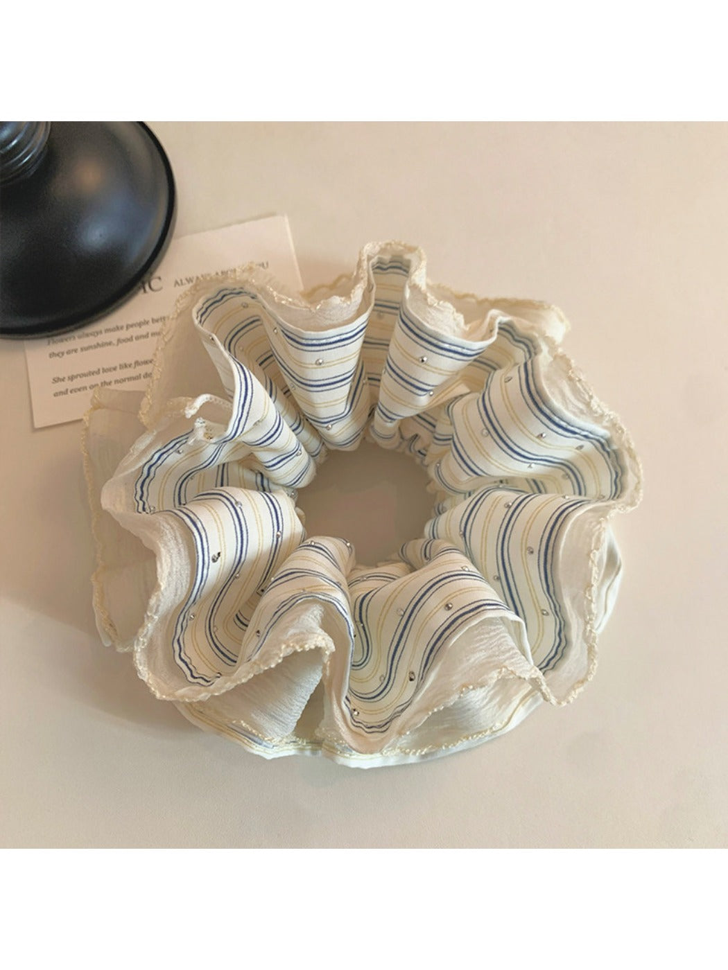 Gifty scrunchie wrapped around a wrist as a fashion accessory with soft fabric details
